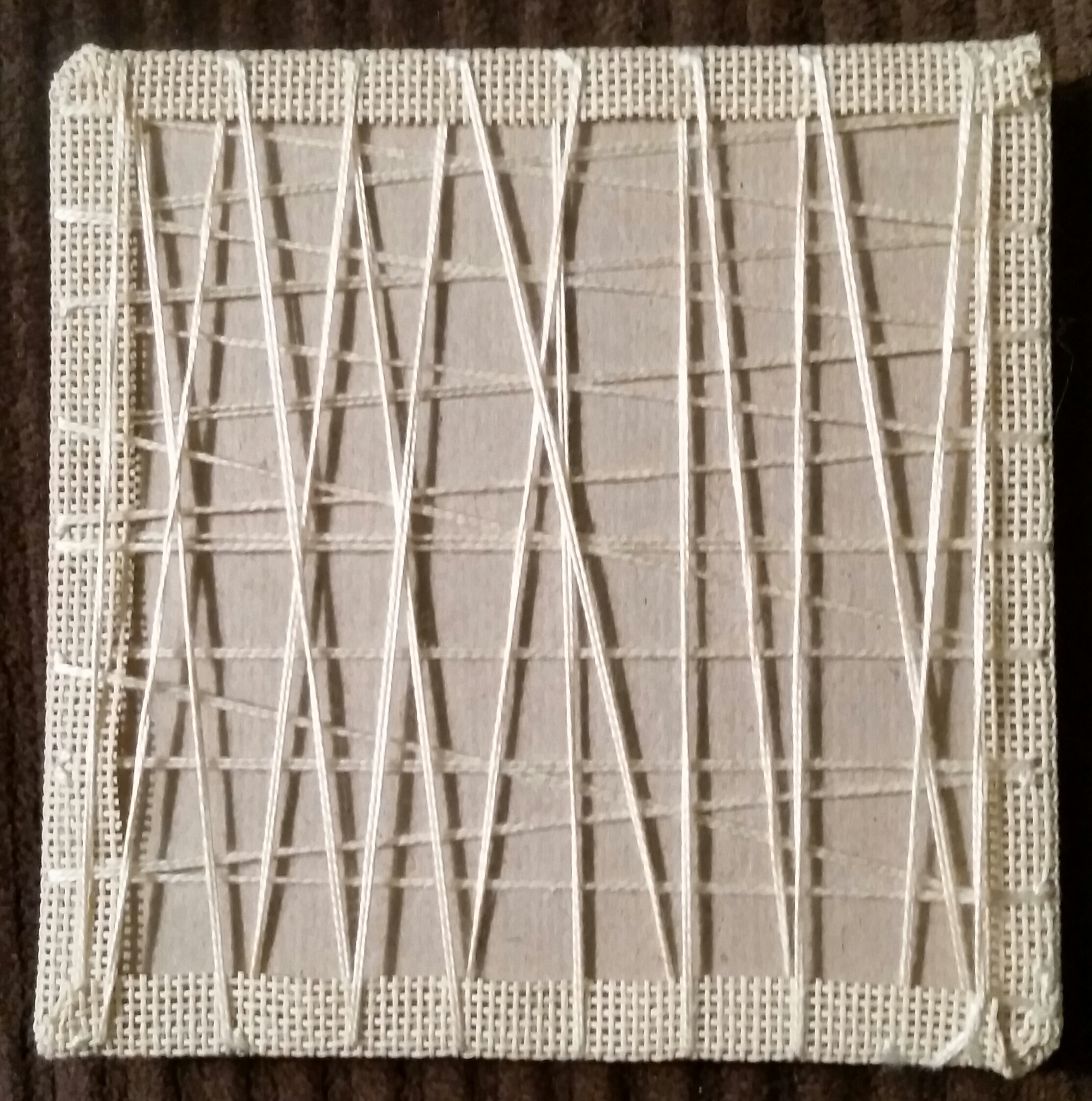 Laced to felt-padded mounting board.jpg